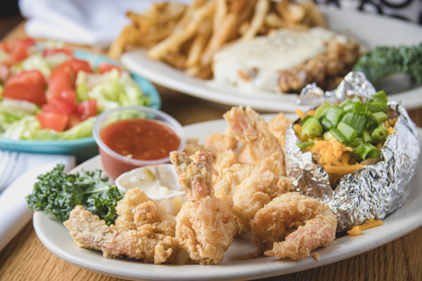 fried shrimps, backed potato, dip